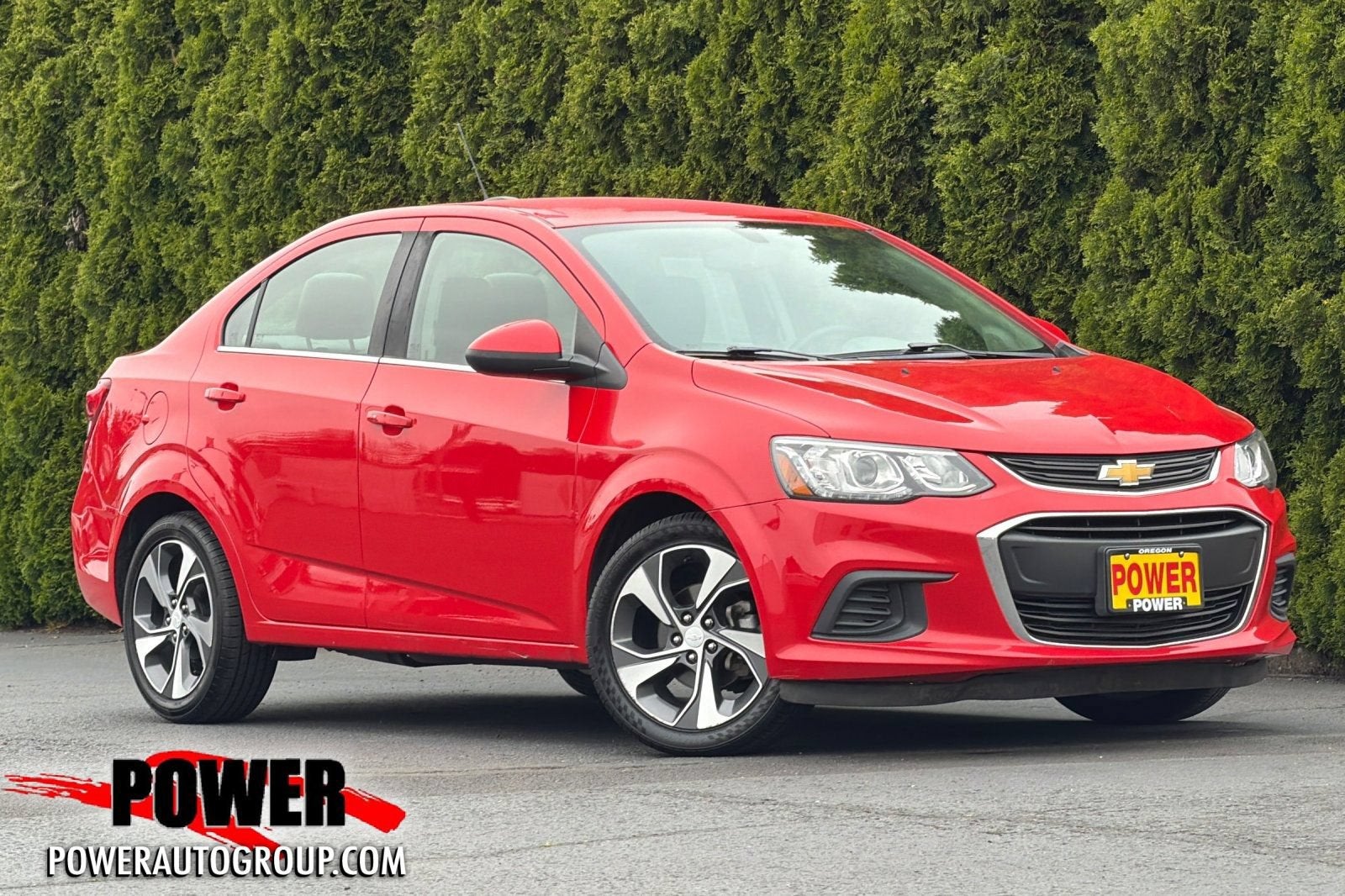 2020 Chevrolet Sonic Premier in Red Hot — front three-quarter view