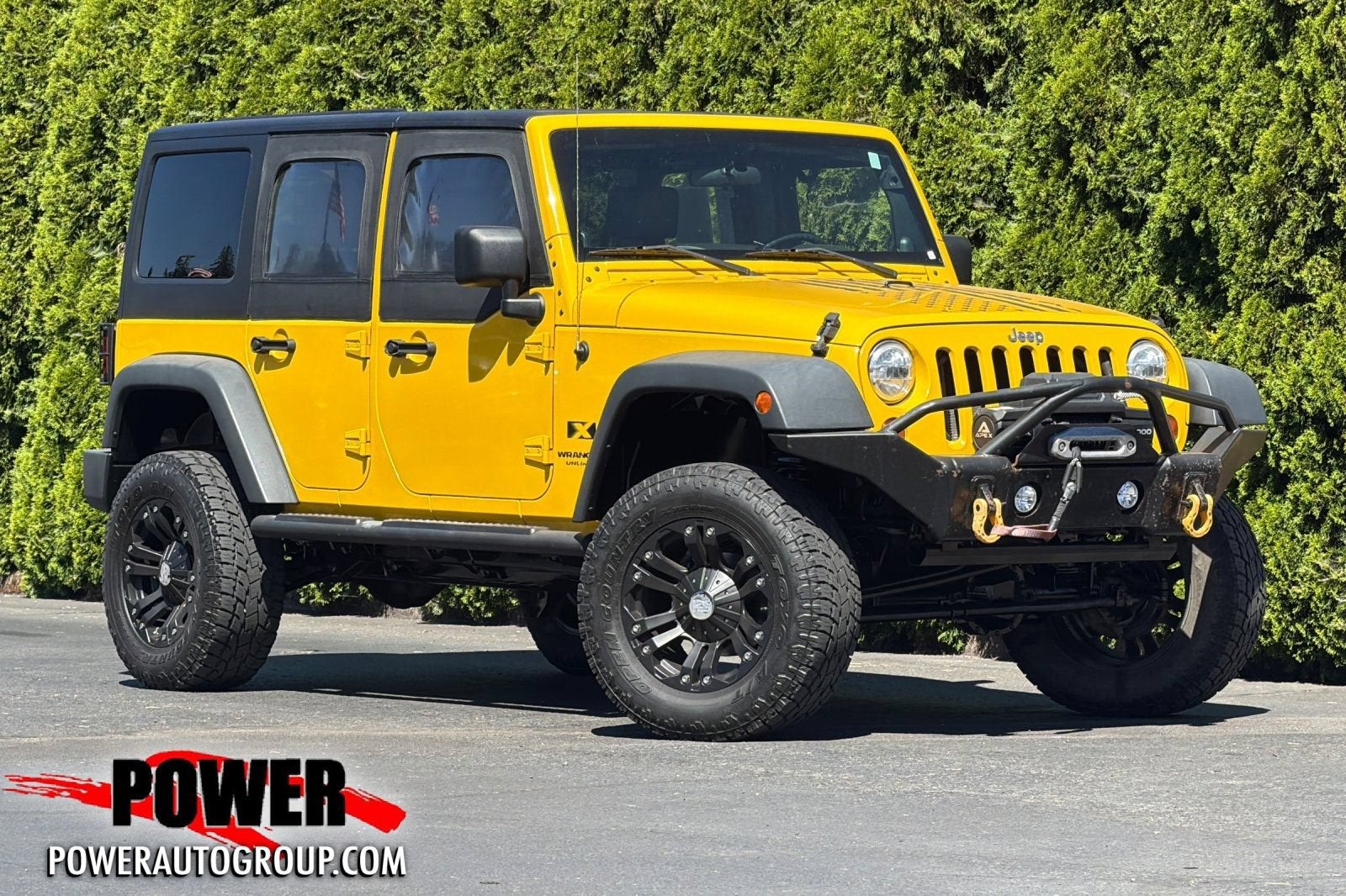 2007 Jeep Wrangler Unlimited X in Detonator Yello — front three-quarter view