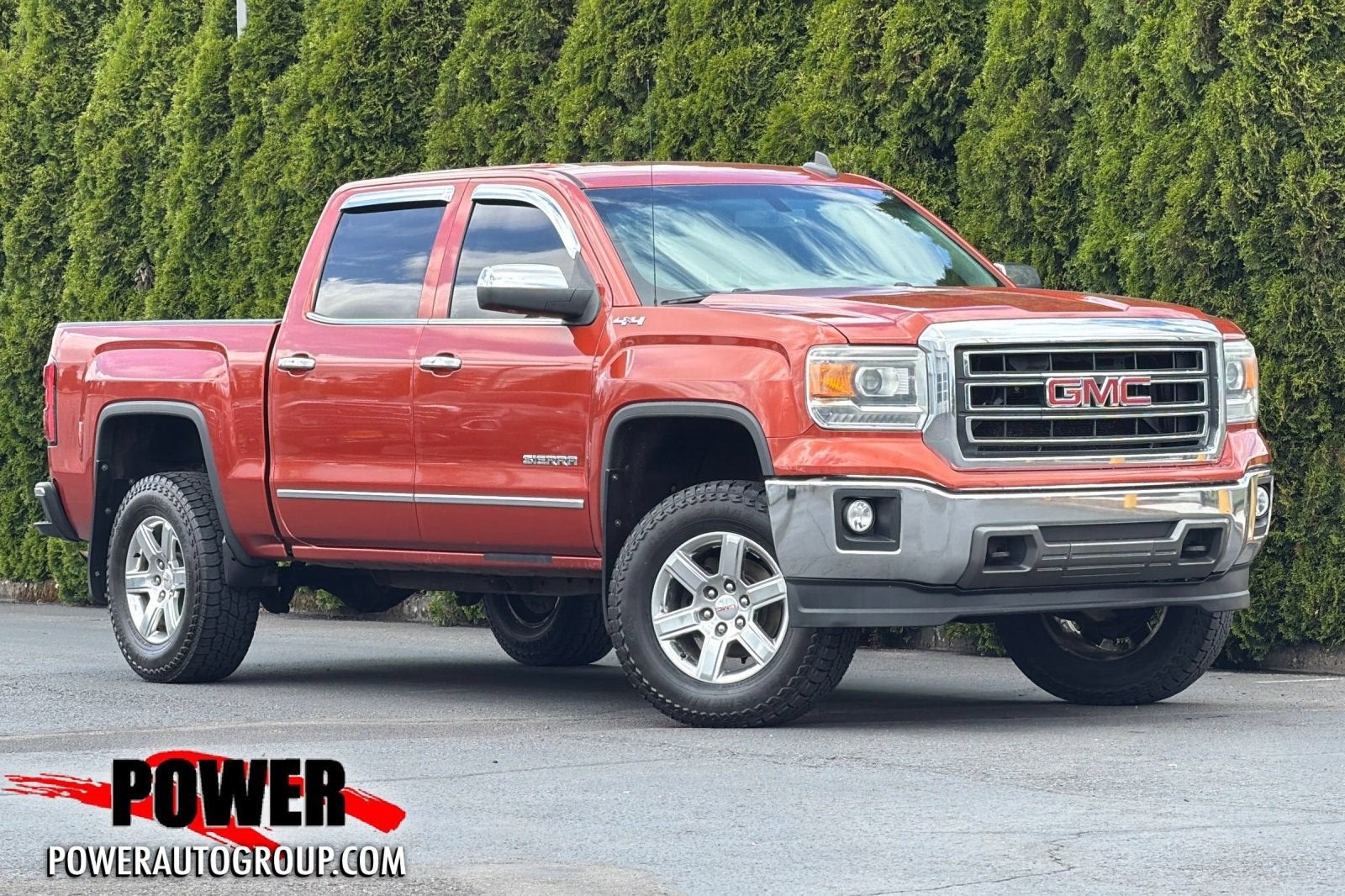 2015 GMC Sierra 1500 SLT in Cayenne Metallic — front three-quarter view