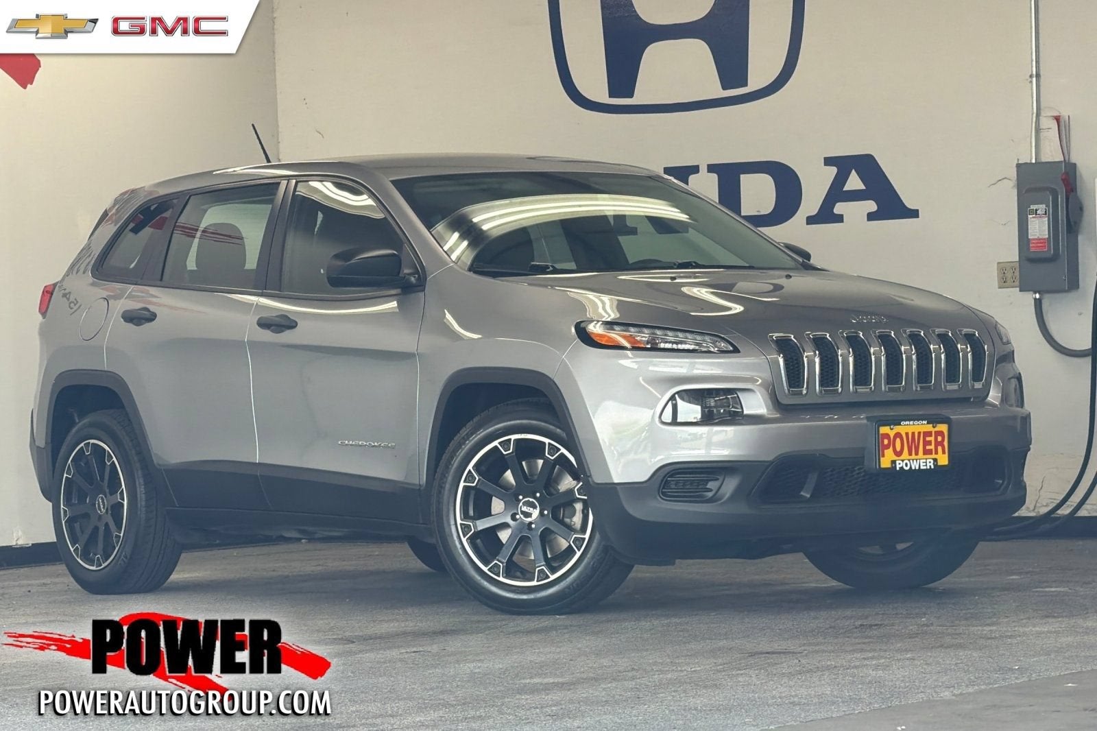 2017 Jeep CHEROKEE Base in Billet Silver M — front three-quarter view