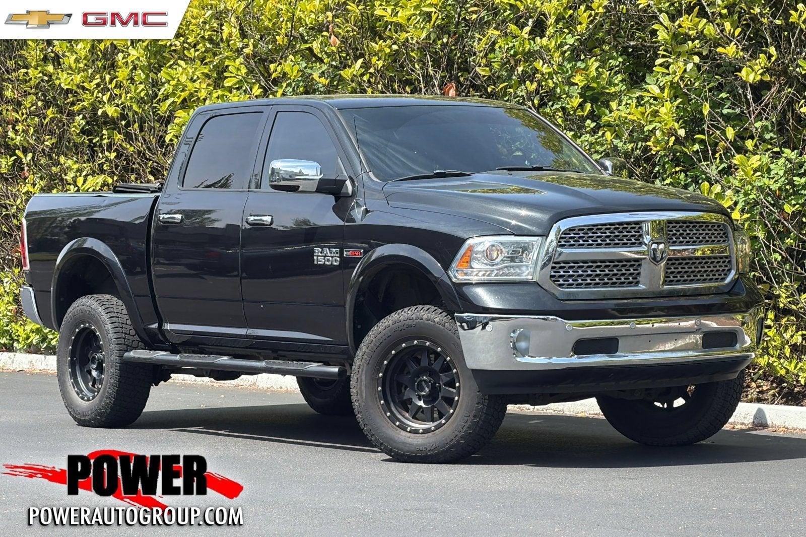 2018 RAM 1500 Laramie in Brilliant Black — front three-quarter view