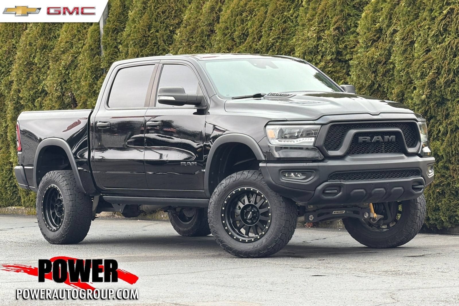 2021 RAM 1500 Rebel in Diamond Black C — front three-quarter view