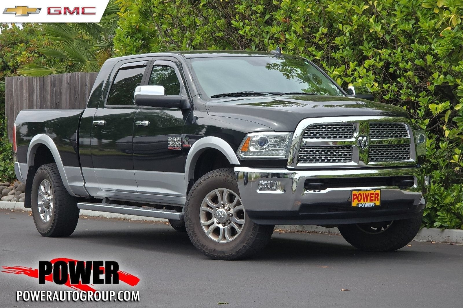 2015 RAM 3500 Laramie in Black Forest Gr — front three-quarter view