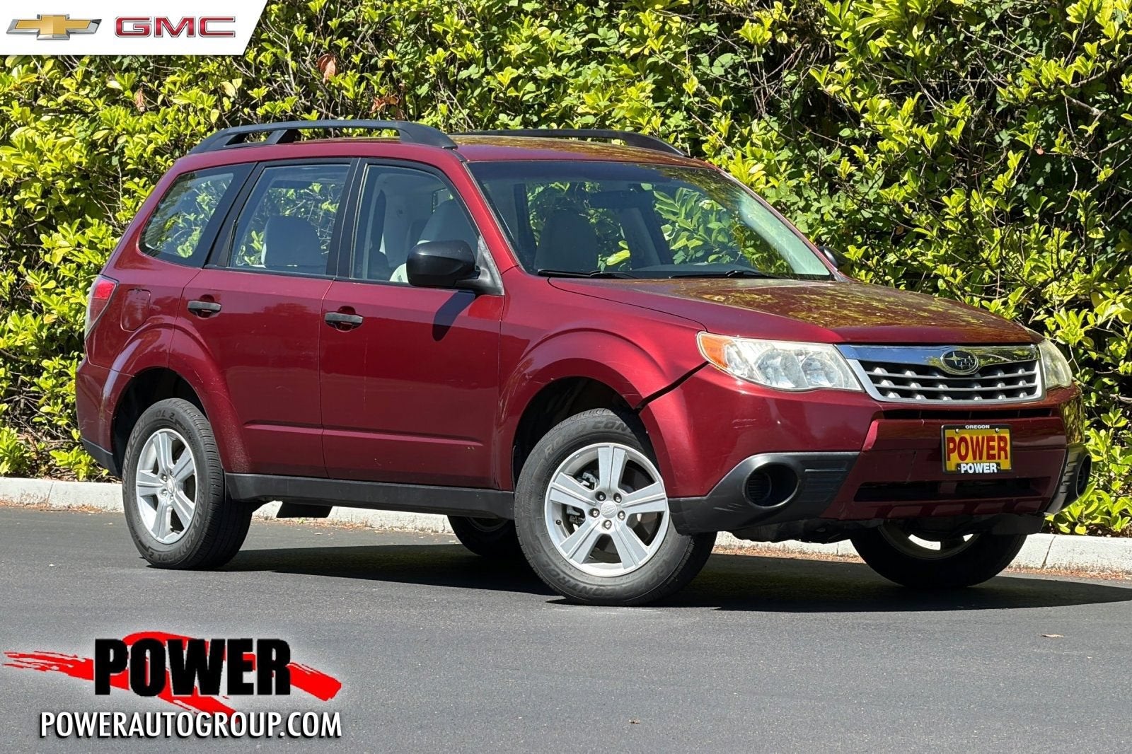 2012 Subaru Forester 2.5X in Camellia Red Pe — front three-quarter view