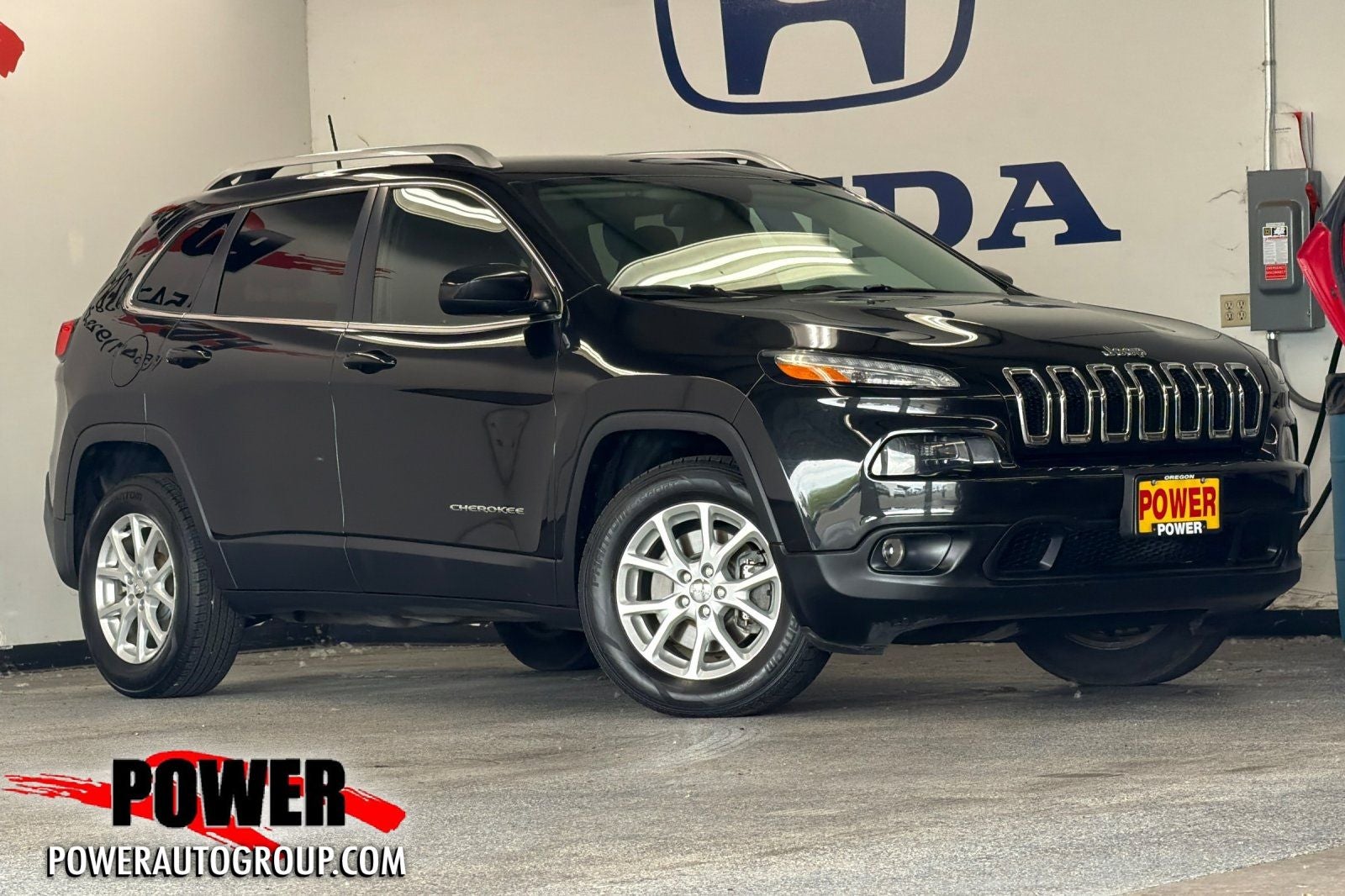 2016 Jeep Cherokee Latitude in Brilliant Black Crystal Pearlcoat — front three-quarter view