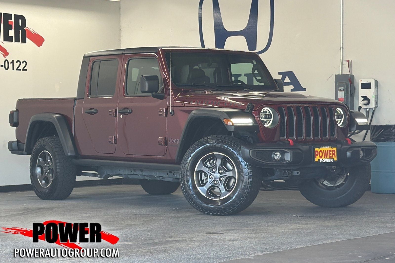 2021 Jeep Gladiator Rubicon in Snazzberry Pearlcoat — front three-quarter view