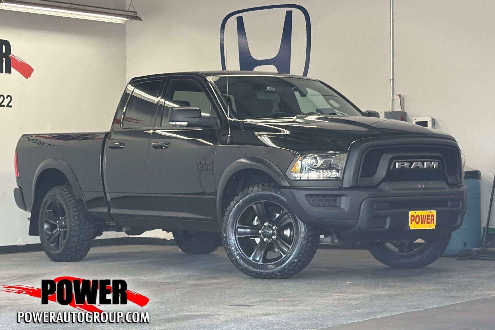 2022 RAM 1500 Classic Warlock in Diamond Black — front three-quarter view
