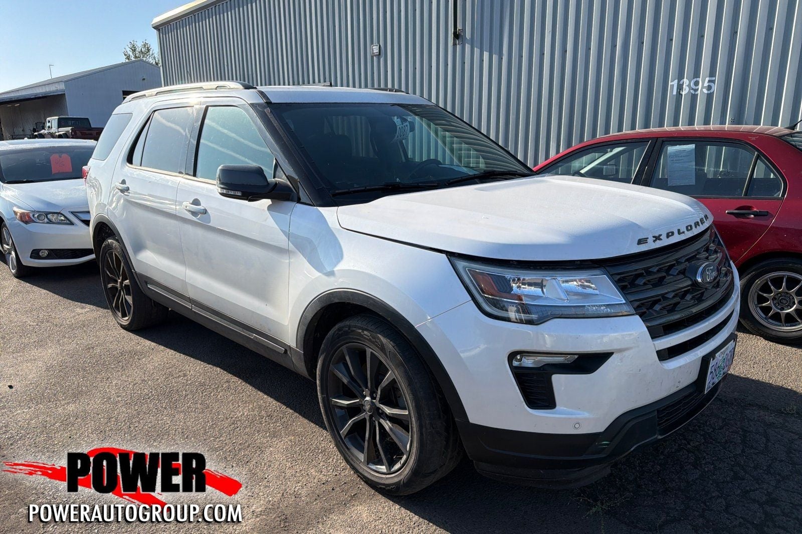 2018 Ford Explorer XLT in White Platinum Clearcoat Metallic — front three-quarter view