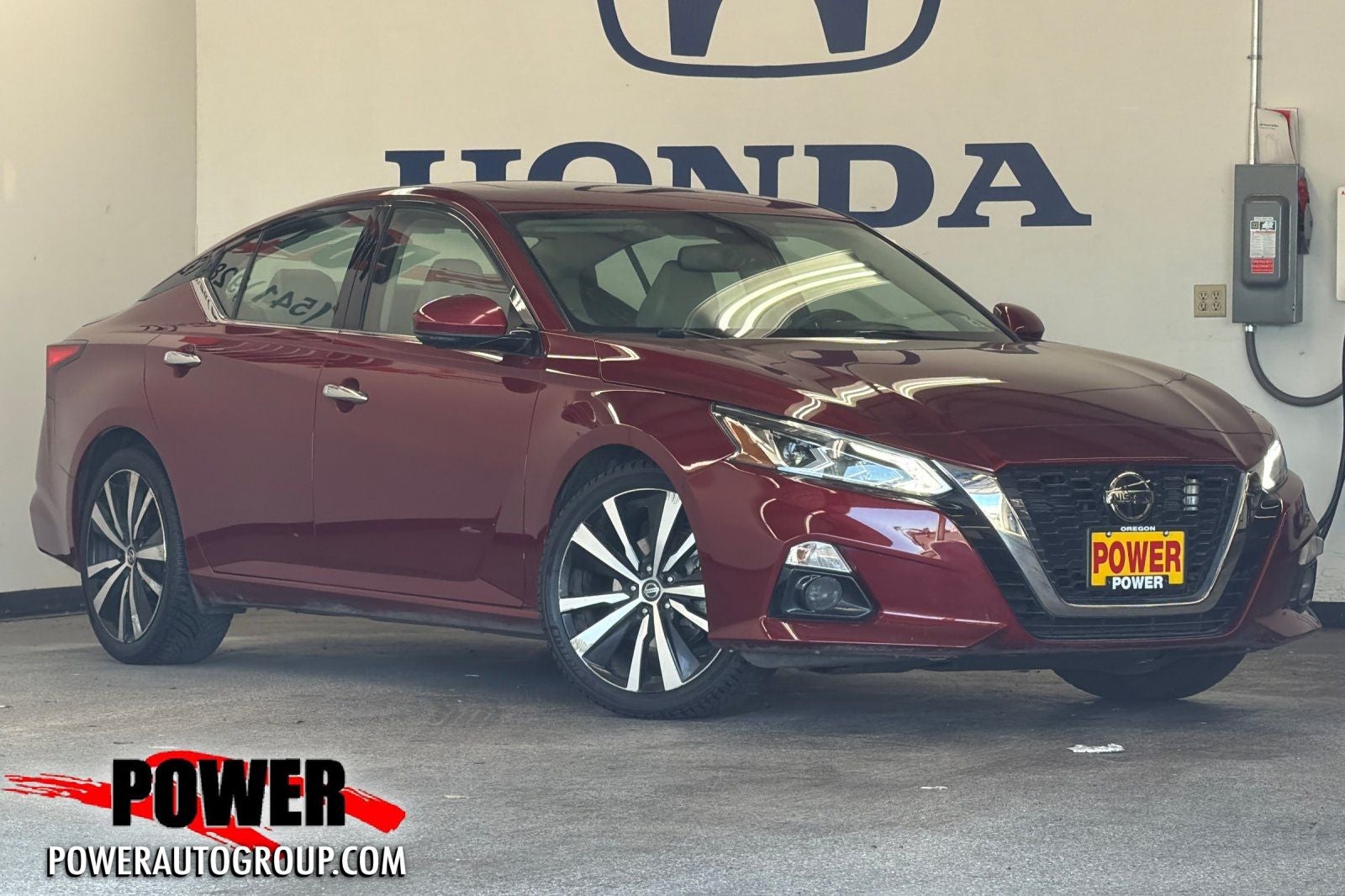 2019 Nissan Altima 2.5 Platinum in Scarlet — front three-quarter view