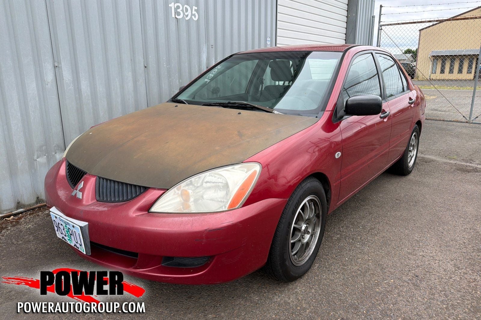 2004 Mitsubishi Lancer ES in Red — front three-quarter view