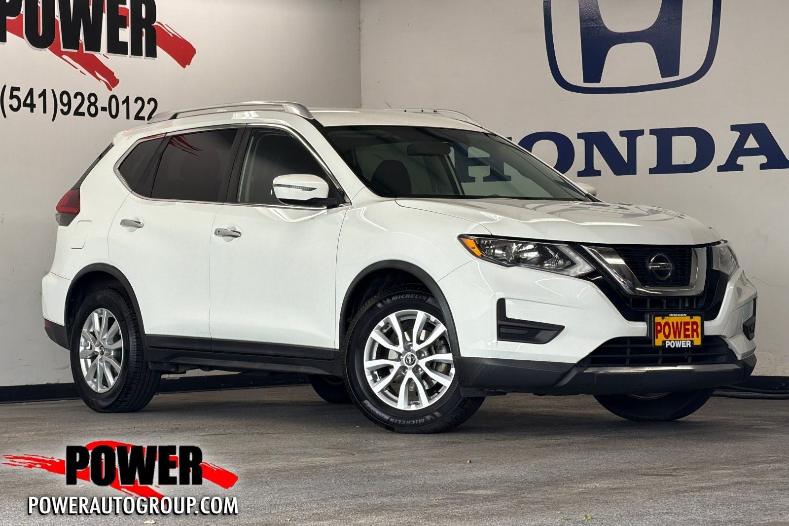 2018 Nissan Rogue SV in Glacier White — front three-quarter view