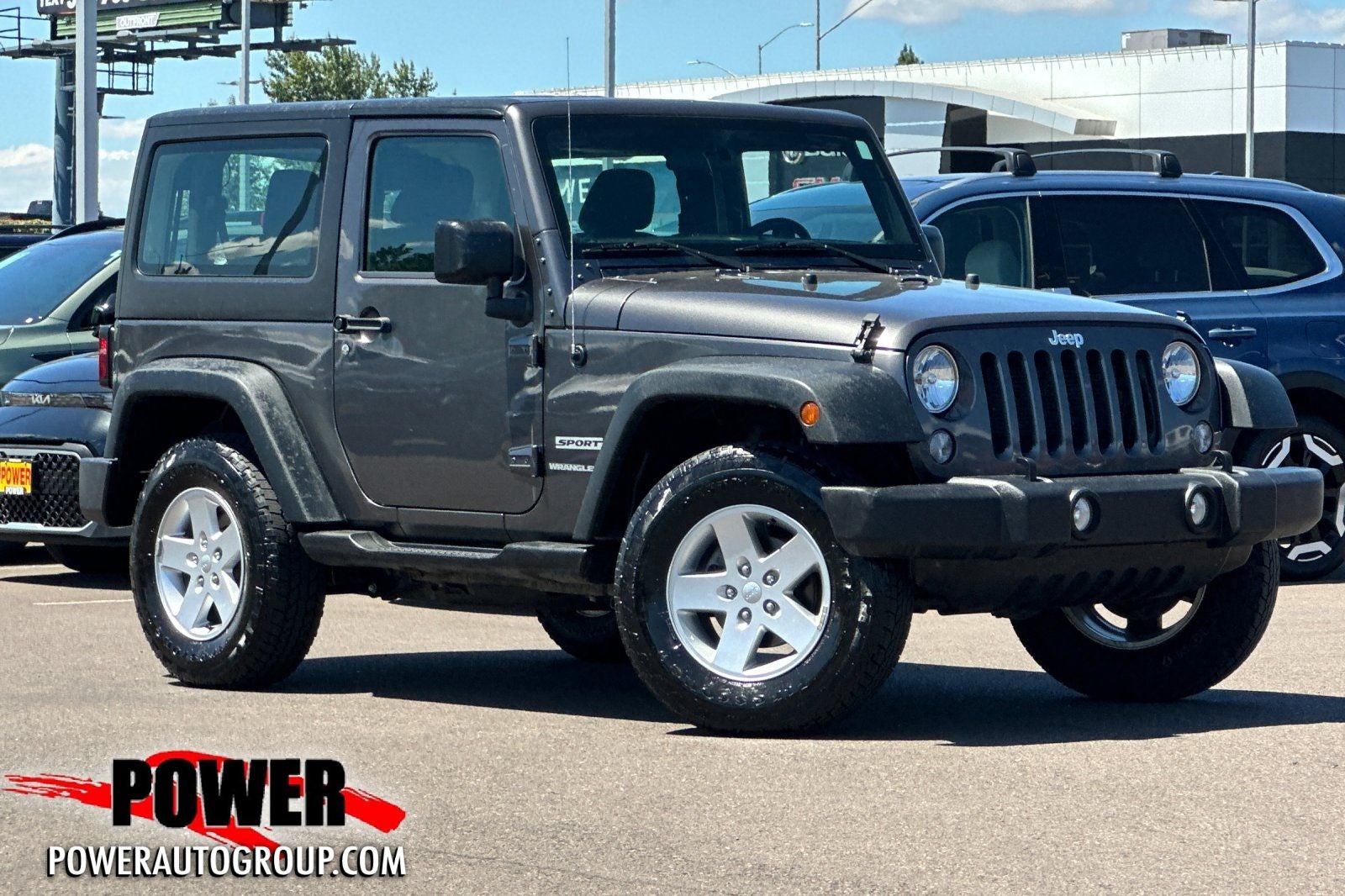 2018 Jeep Wrangler JK Sport in Granite Crystal Metallic Clearcoat — front three-quarter view