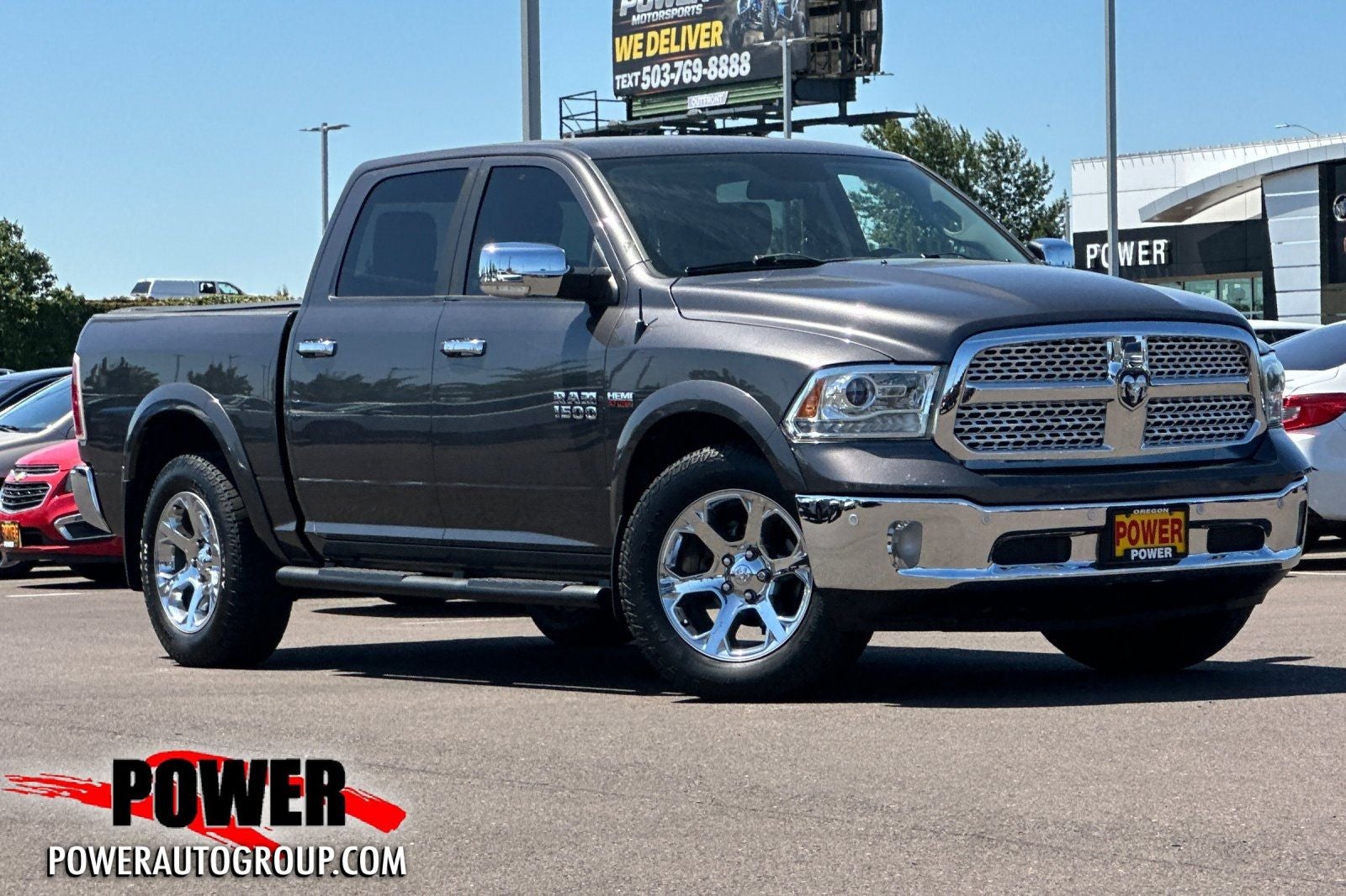 2016 RAM 1500 Laramie in Granite Crystal Metallic Clearcoat — front three-quarter view