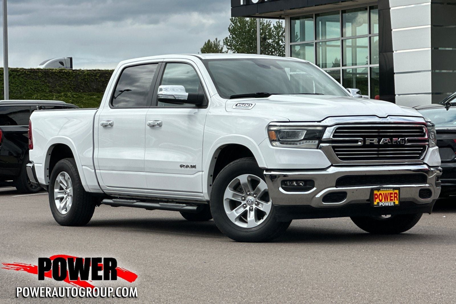 2022 RAM 1500 Laramie in Bright White Clearcoat — front three-quarter view
