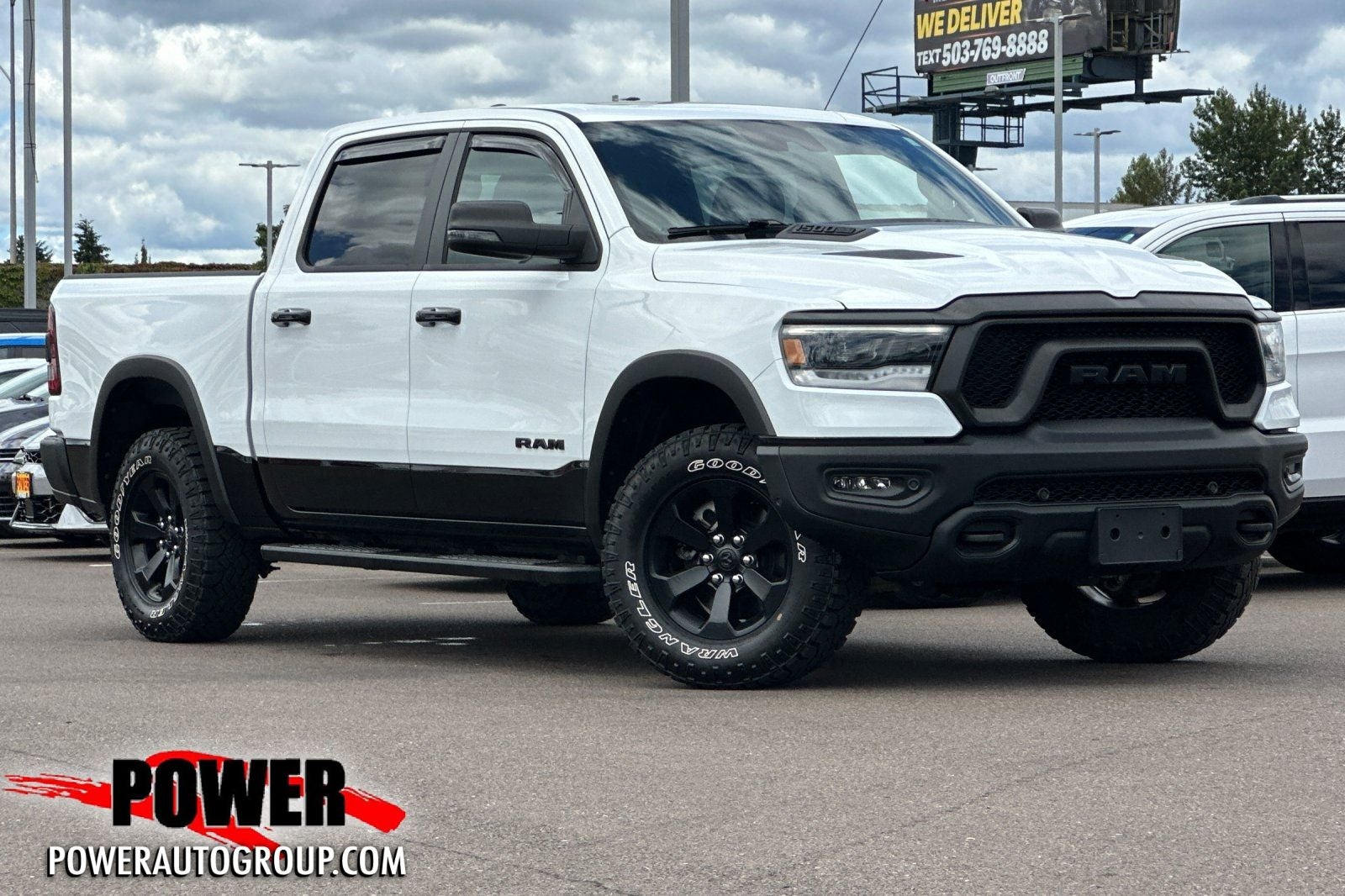 2024 RAM 1500 Rebel in Bright White Clearcoat — front three-quarter view
