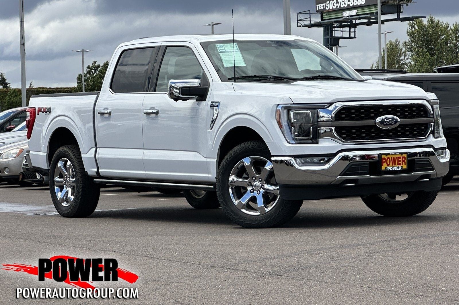 2021 Ford F-150 King Ranch in Oxford White — front three-quarter view