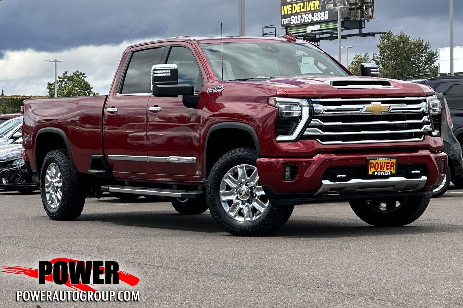 2024 Chevrolet Silverado 3500HD High Country in Radiant Red — front three-quarter view