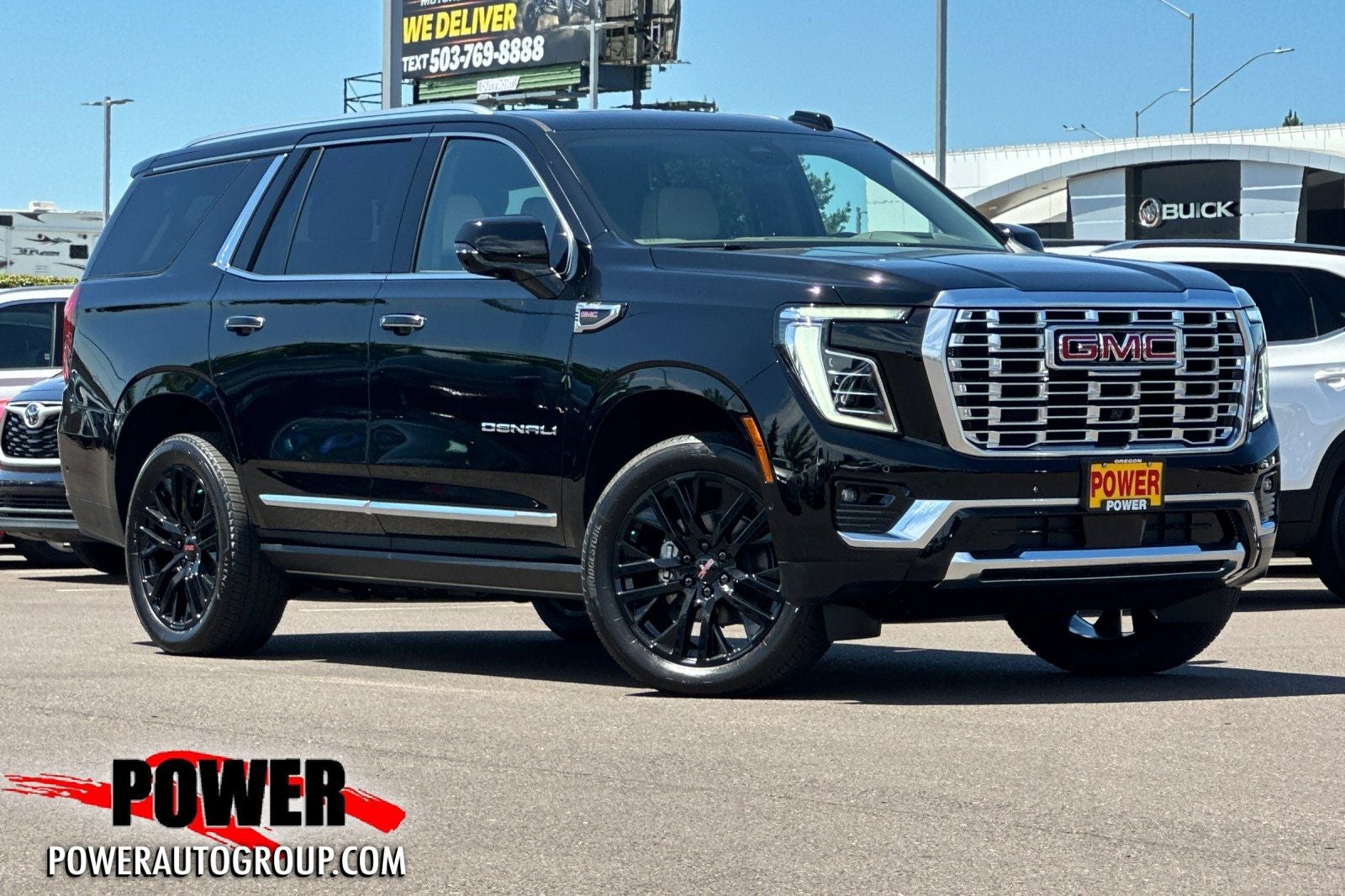 2026 GMC Yukon Denali in Onyx Black — front three-quarter view