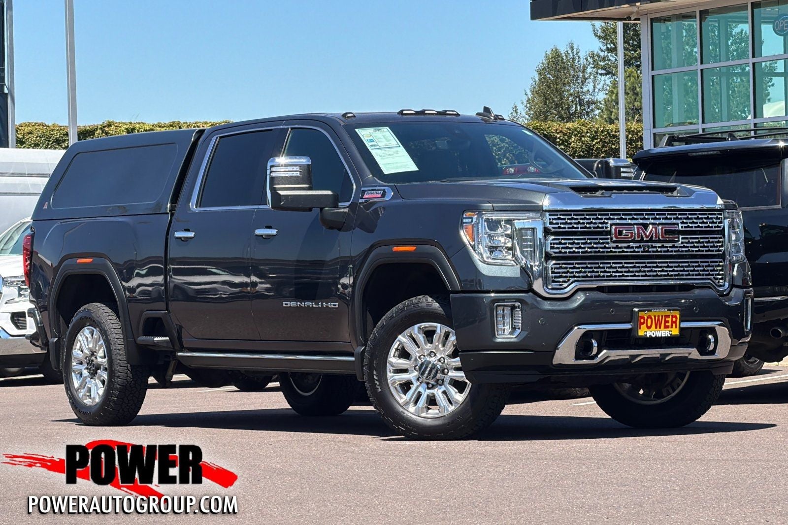 2021 GMC Sierra 2500HD Denali in Hunter Metallic — front three-quarter view