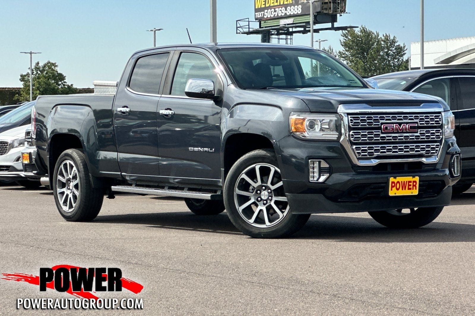 2021 GMC Canyon Denali in Hunter Green — front three-quarter view