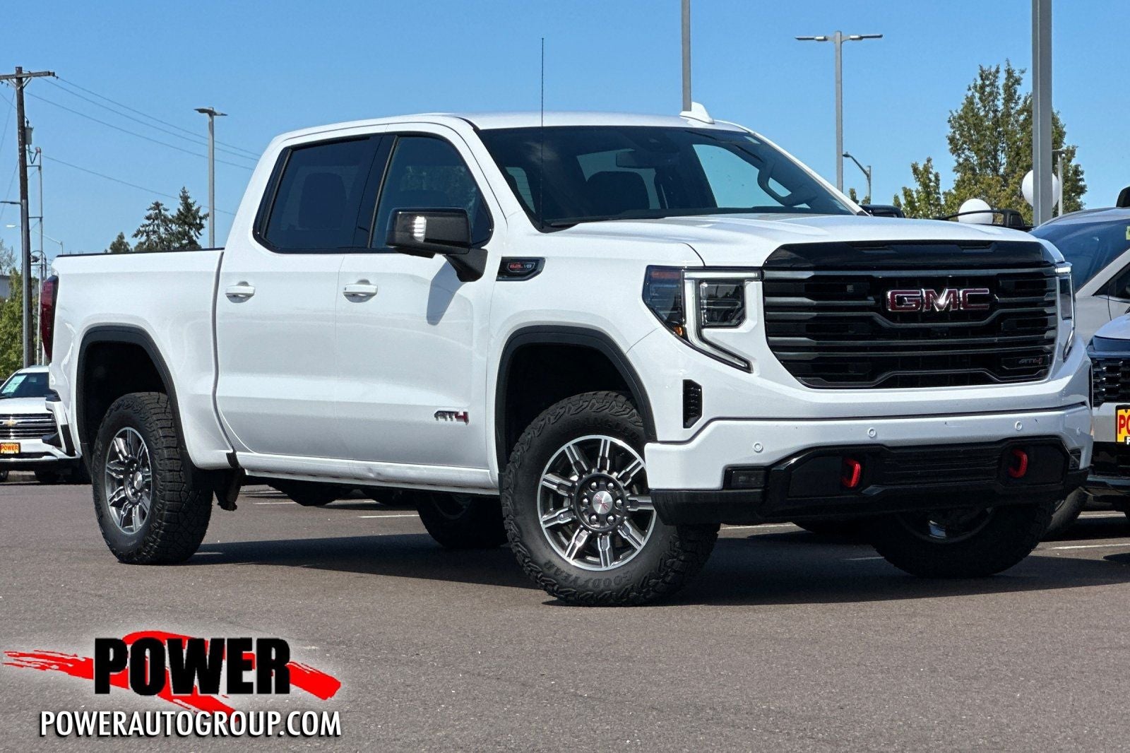 2025 GMC Sierra 1500 AT4 in Summit White — front three-quarter view