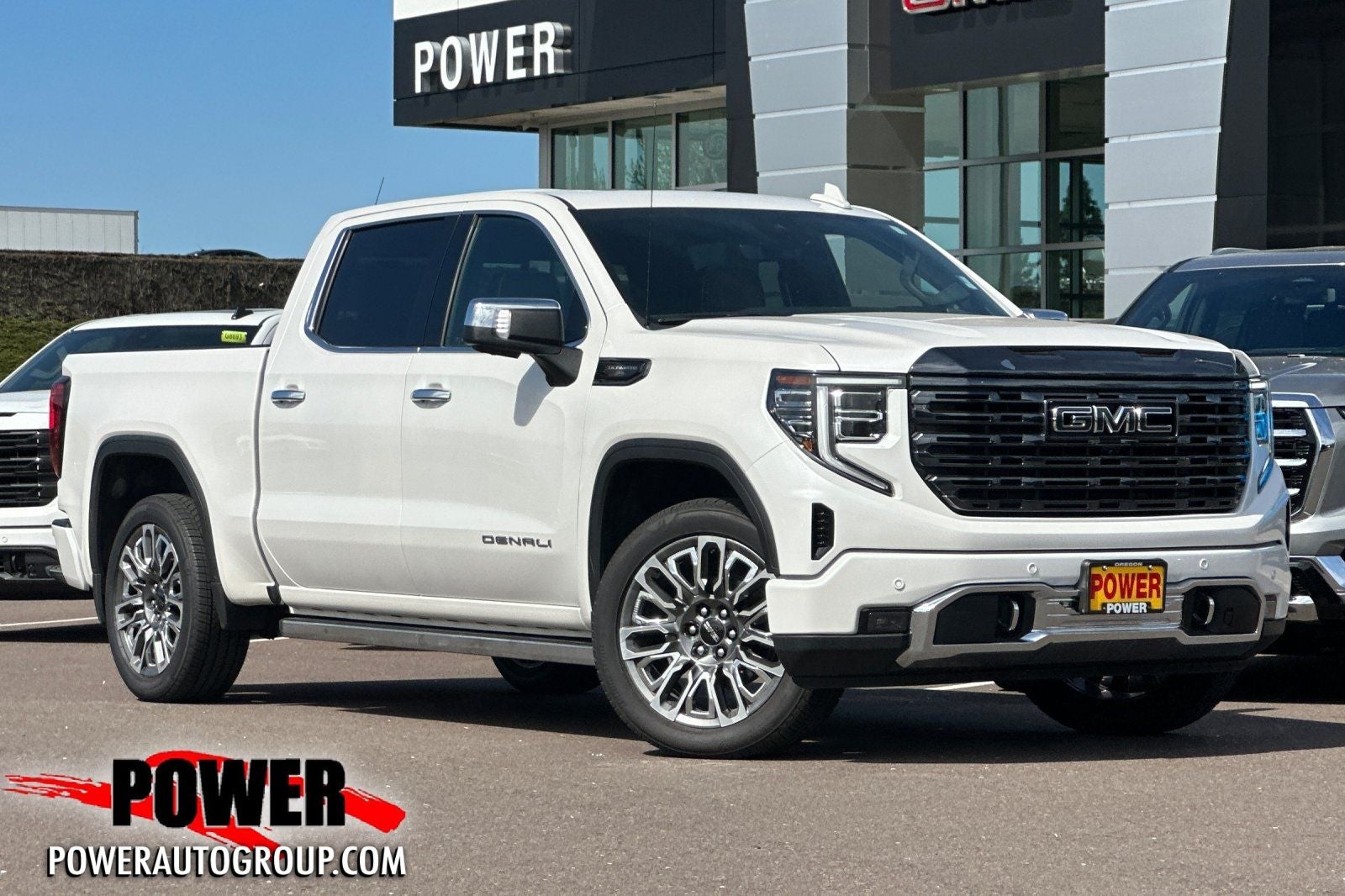 2023 GMC Sierra 1500 Denali Ultimate in White Frost — front three-quarter view