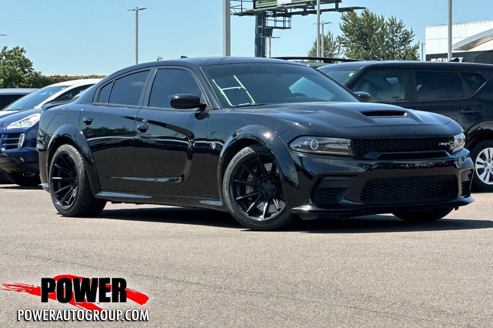 2021 Dodge Charger SRT Hellcat Widebody in Pitch Black Clearcoat — front three-quarter view