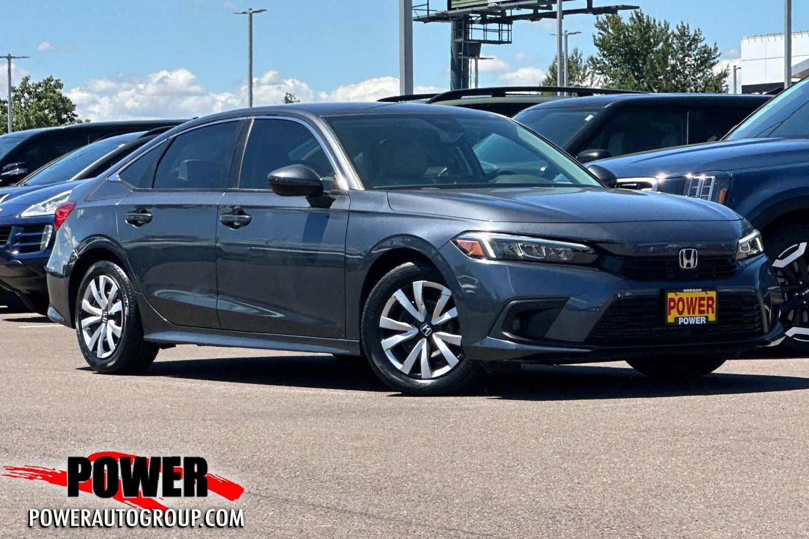 2023 Honda Civic LX in Gray Metallic — front three-quarter view