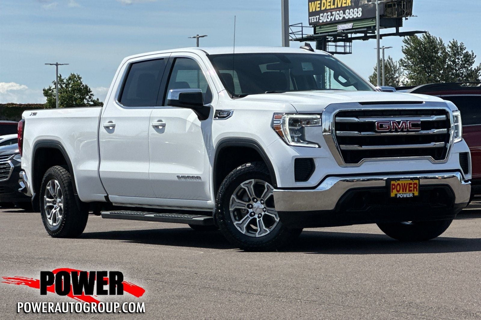 2021 GMC Sierra 1500 SLE in Summit White — front three-quarter view