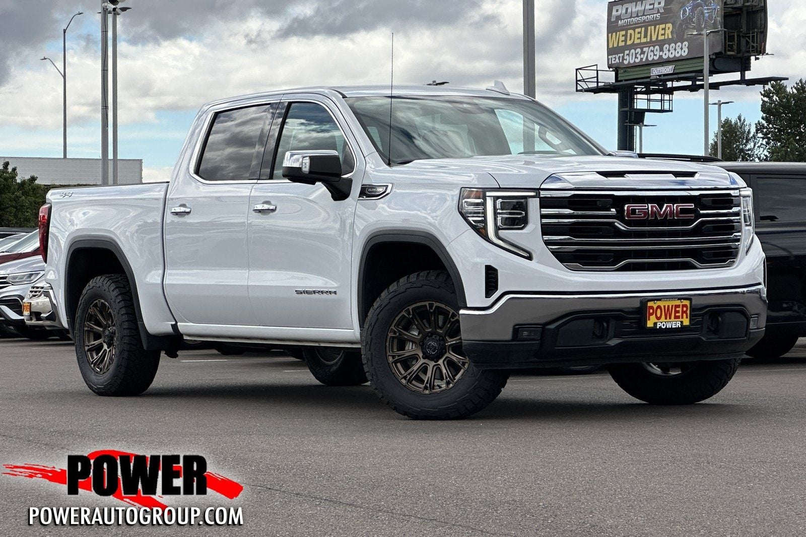 2024 GMC Sierra 1500 SLT in Summit White — front three-quarter view