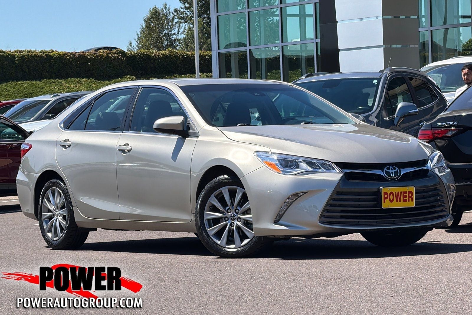 2015 Toyota Camry XLE in Creme Brulee — front three-quarter view