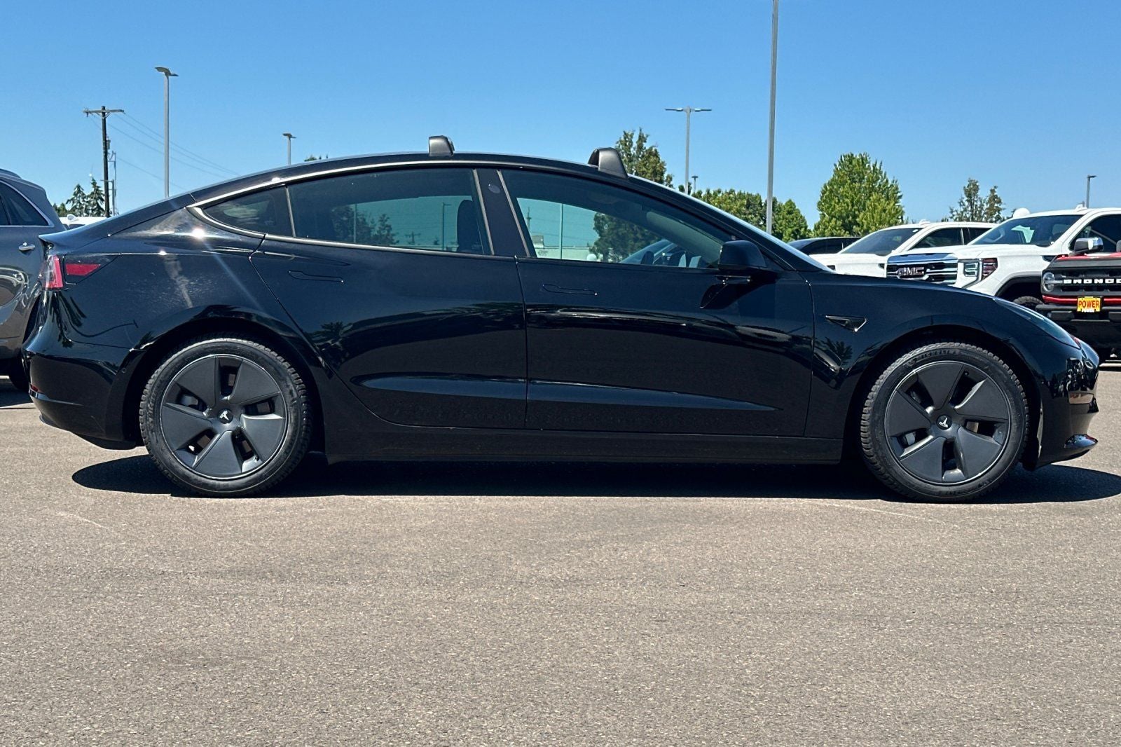 2021 Tesla Model 3 — rear three-quarter view