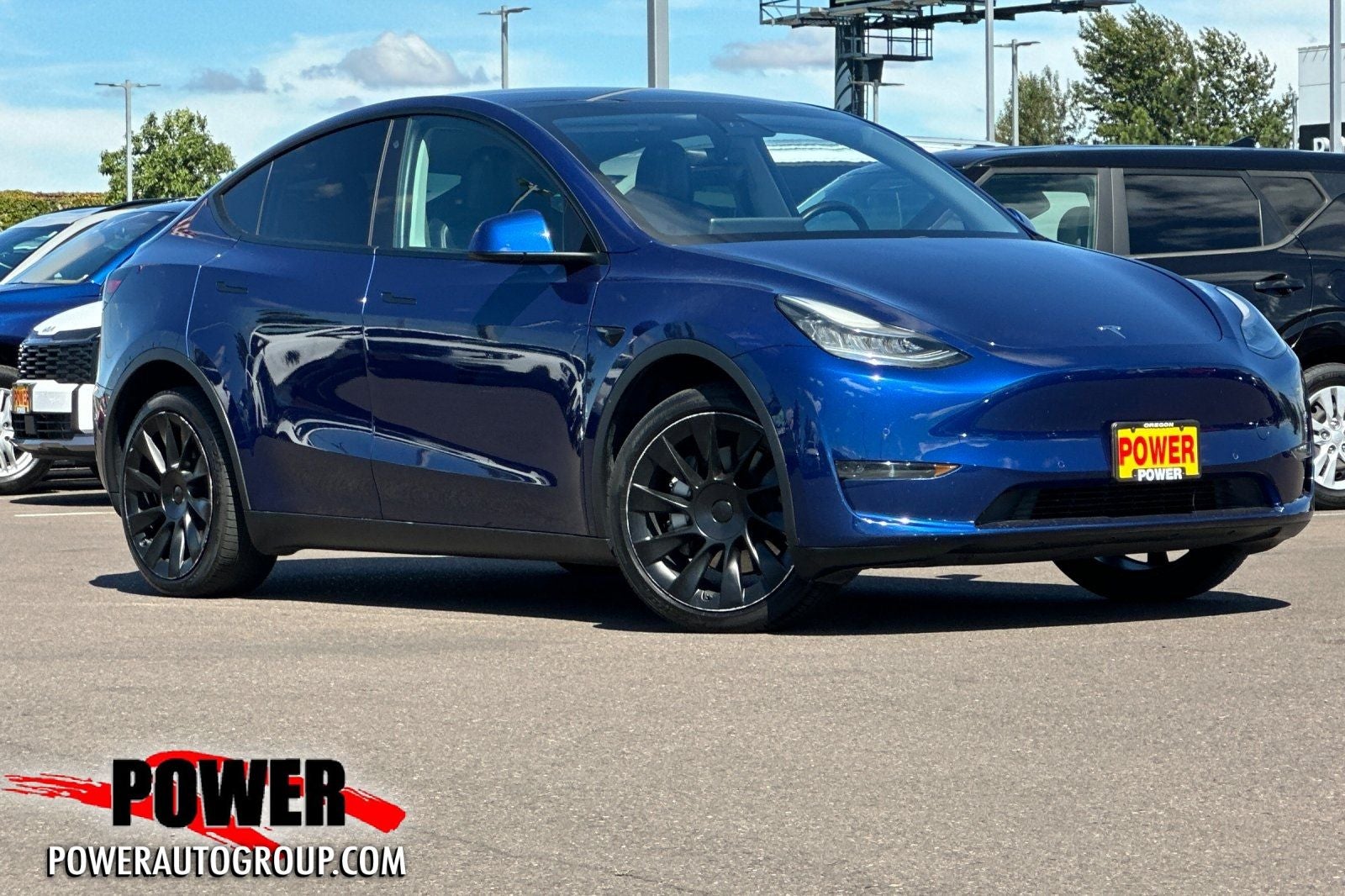 2020 Tesla Model Y Long Range in Deep Blue Metallic — front three-quarter view