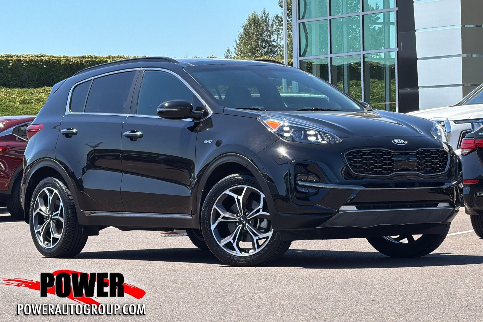 2020 Kia Sportage SX in Black Cherry Pearl — front three-quarter view