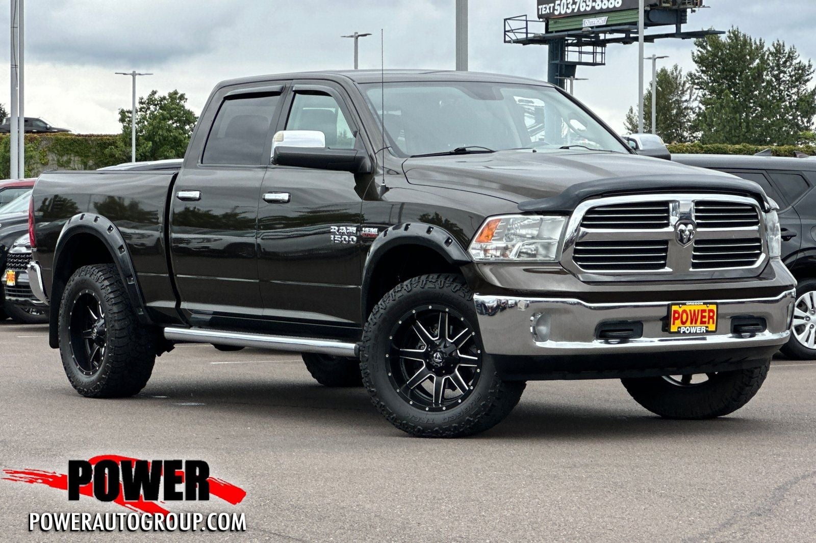 2014 RAM 1500 Big Horn in Black Gold Pearlcoat — front three-quarter view