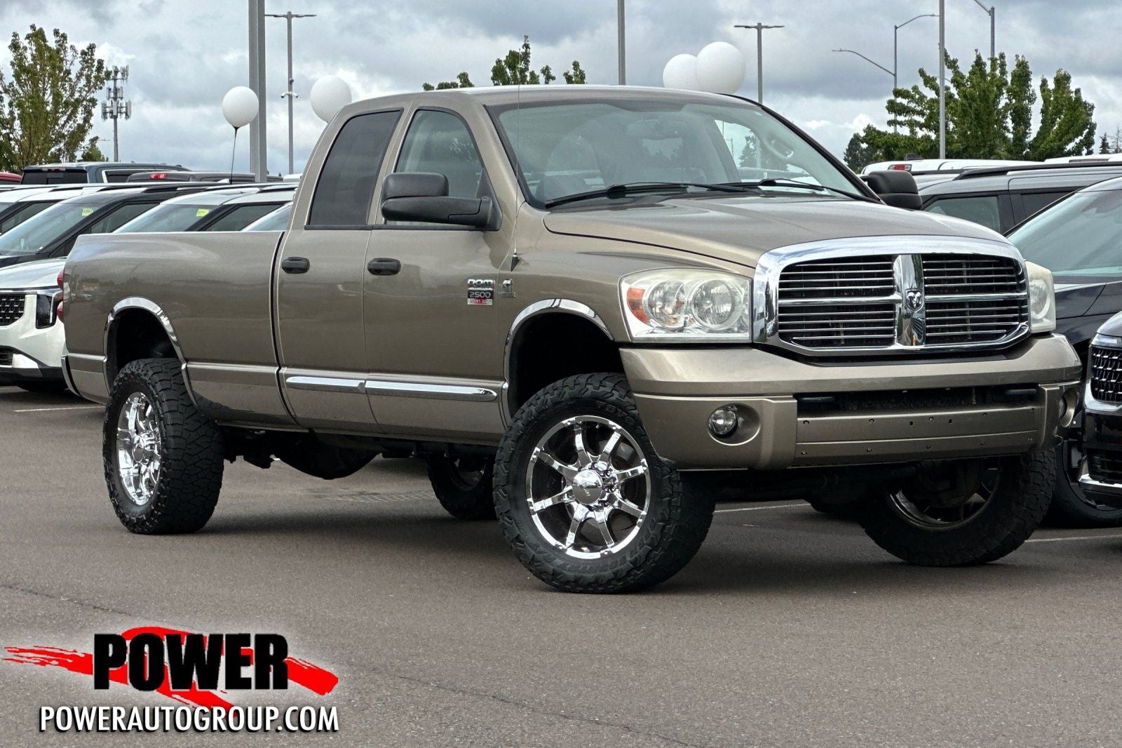2007 Dodge Ram 2500 Laramie in Light Khaki Metallic Clearcoat — front three-quarter view