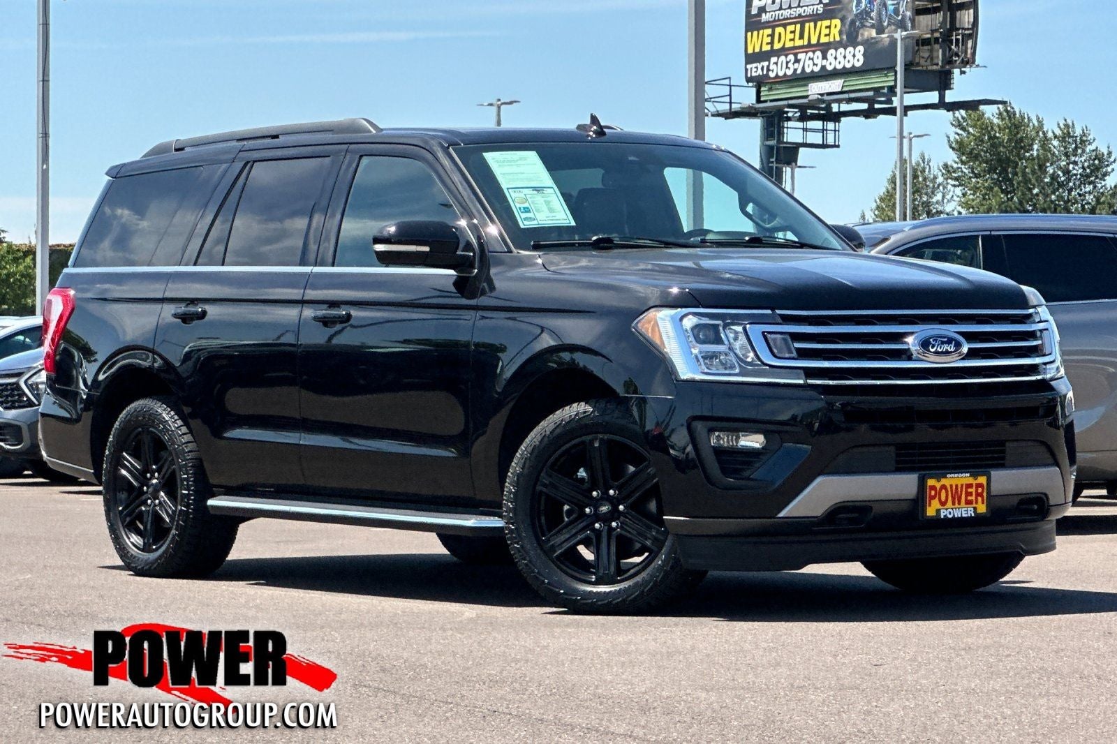 2021 Ford Expedition XLT in Black Metallic — front three-quarter view