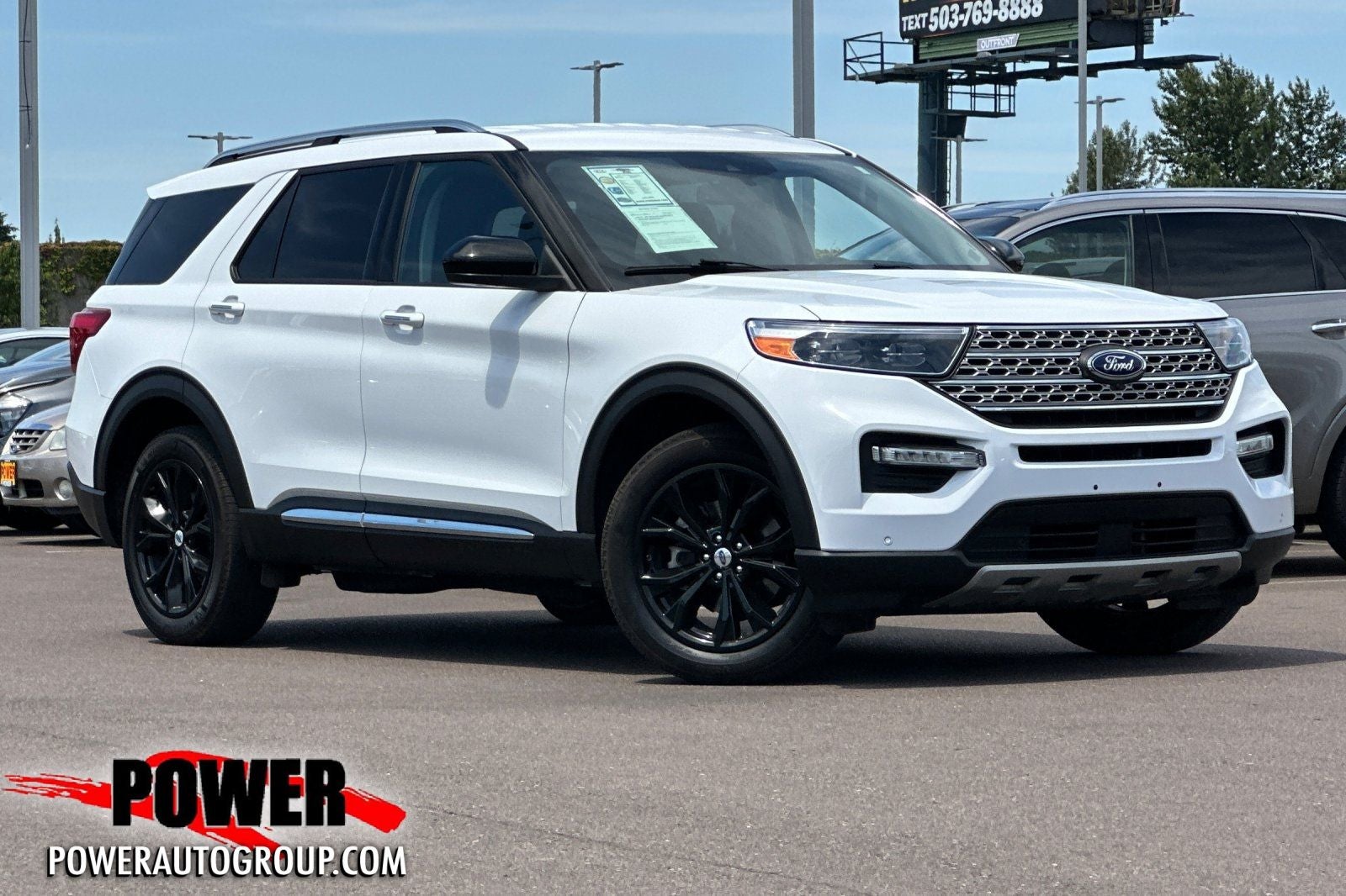2023 Ford Explorer Limited in Oxford White — front three-quarter view