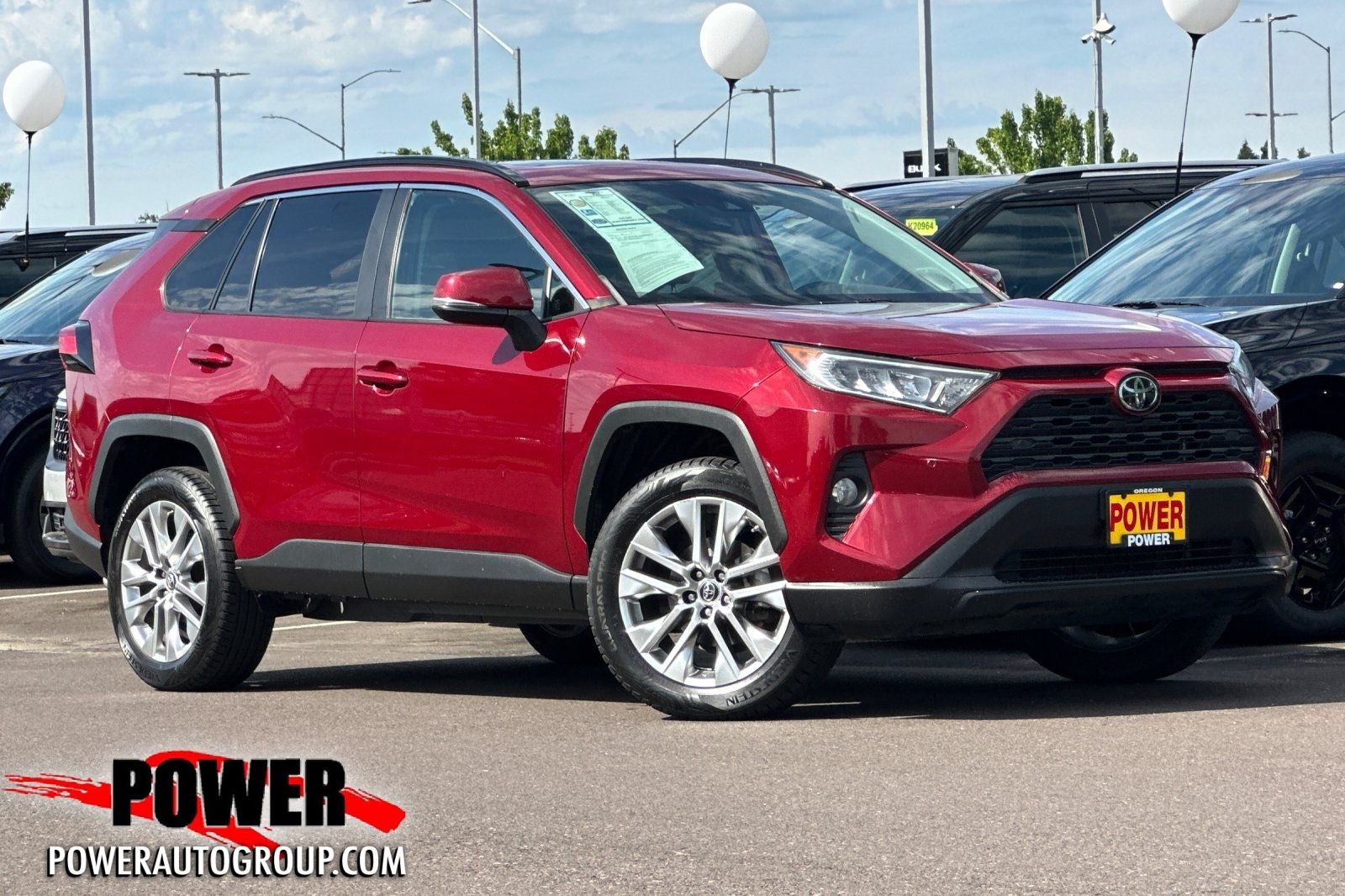 2019 Toyota RAV4 XLE Premium in Pearl — front three-quarter view