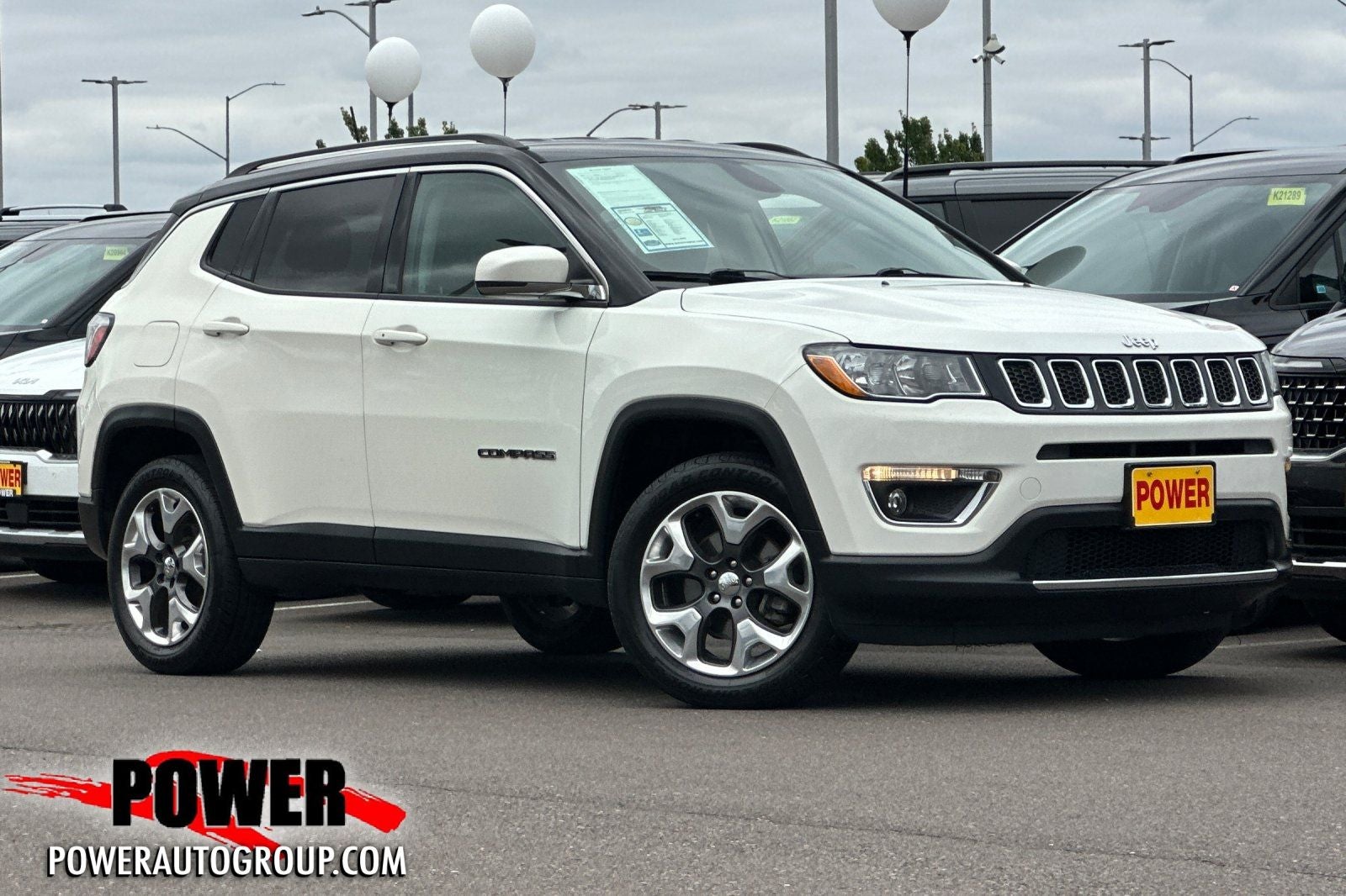 2017 Jeep Compass Limited in White Clearcoat — front three-quarter view
