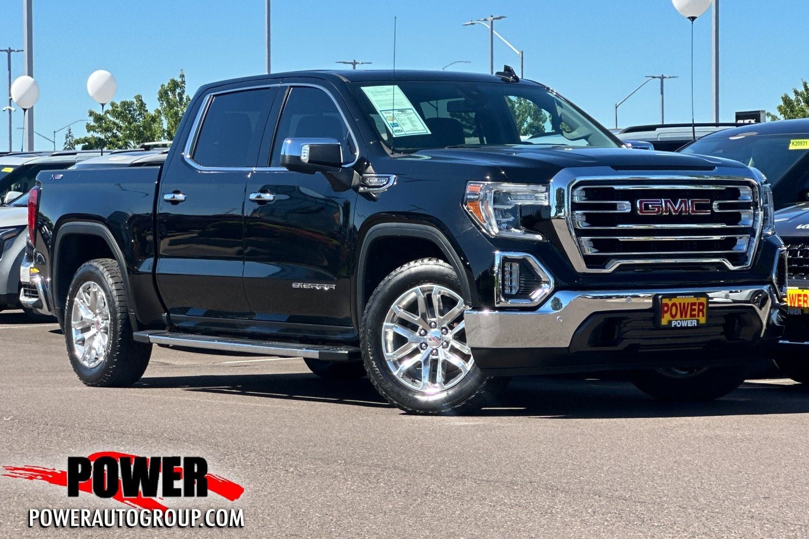 2019 GMC Sierra 1500 SLT in Onyx Black — front three-quarter view