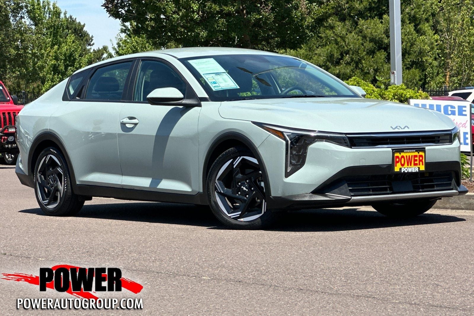 2025 Kia K4 EX in Morning Haze — front three-quarter view