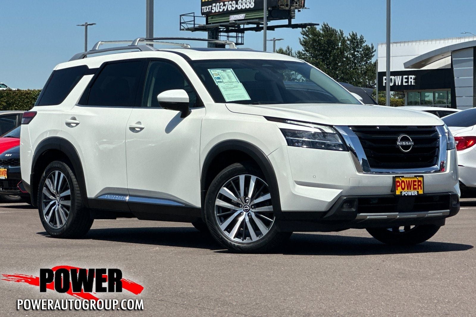 2022 Nissan Pathfinder Platinum in White — front three-quarter view