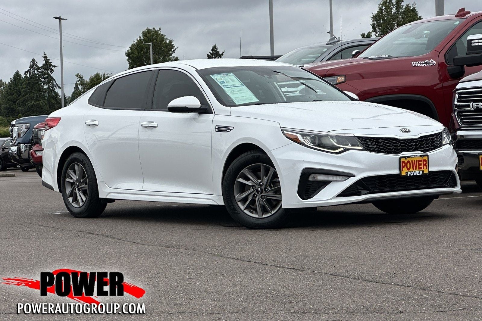 2020 Kia Optima LX in Snow White Pearl — front three-quarter view