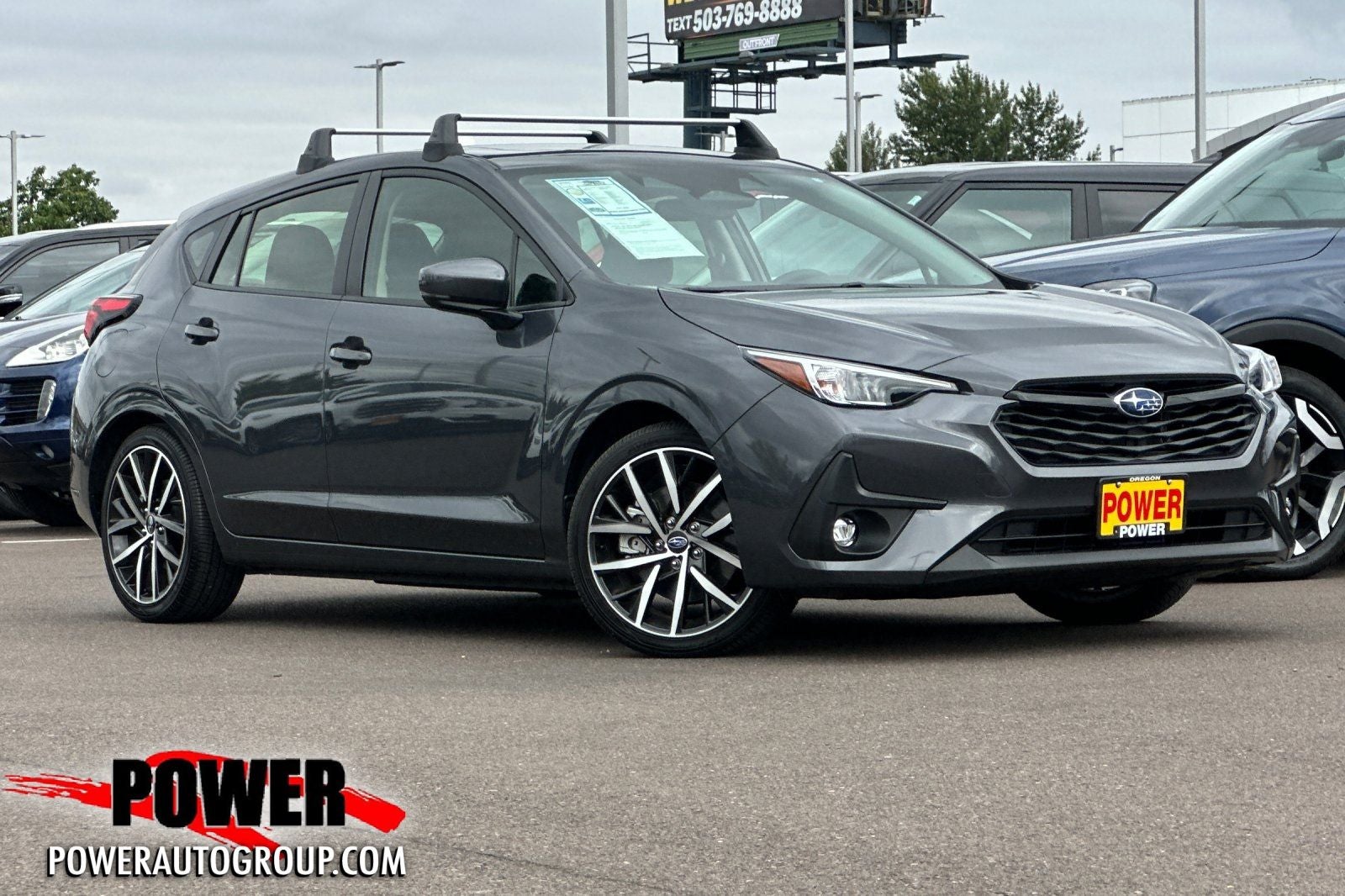 2024 Subaru Impreza Sport in Gray Metallic — front three-quarter view