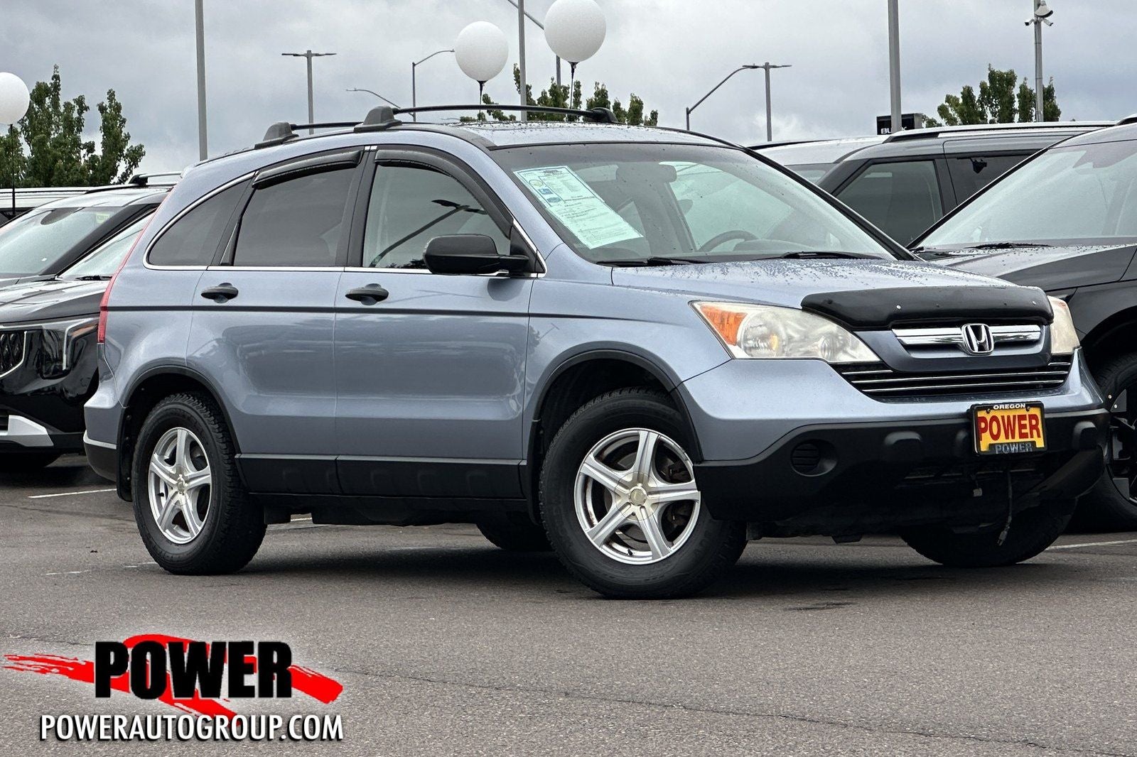 2009 Honda CR-V EX in Blue — front three-quarter view
