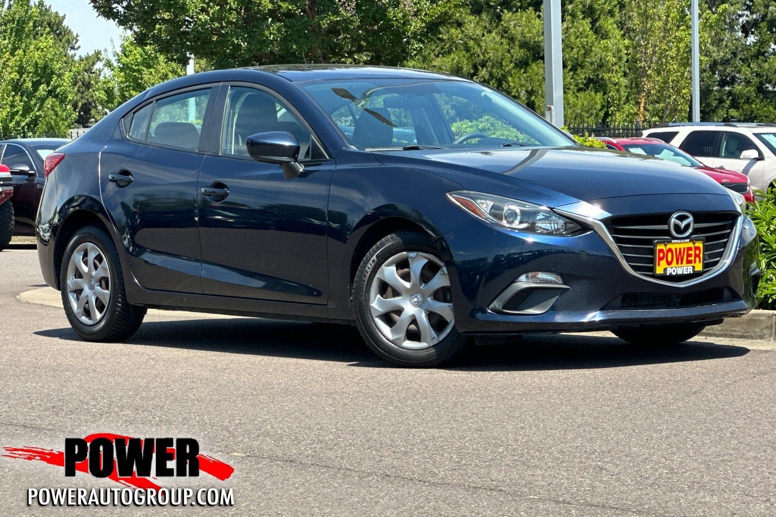2014 Mazda Mazda3 i Sport in Deep Crystal Blue Mica — front three-quarter view