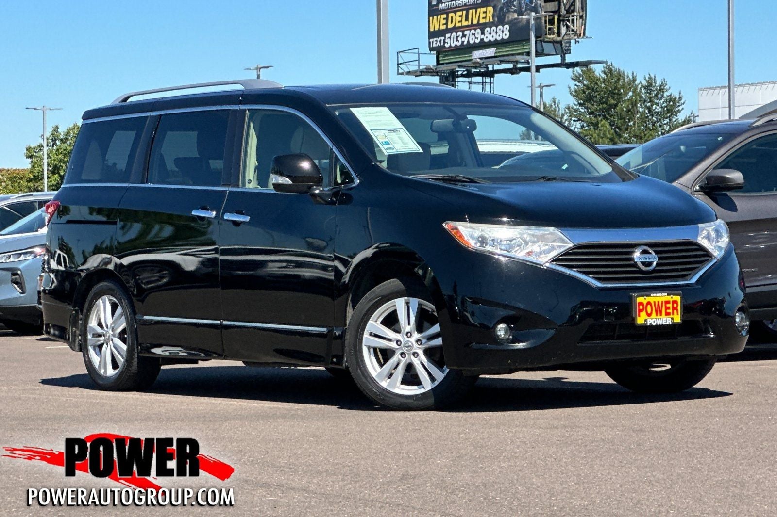 2014 Nissan Quest 3.5 SL in Super Black — front three-quarter view