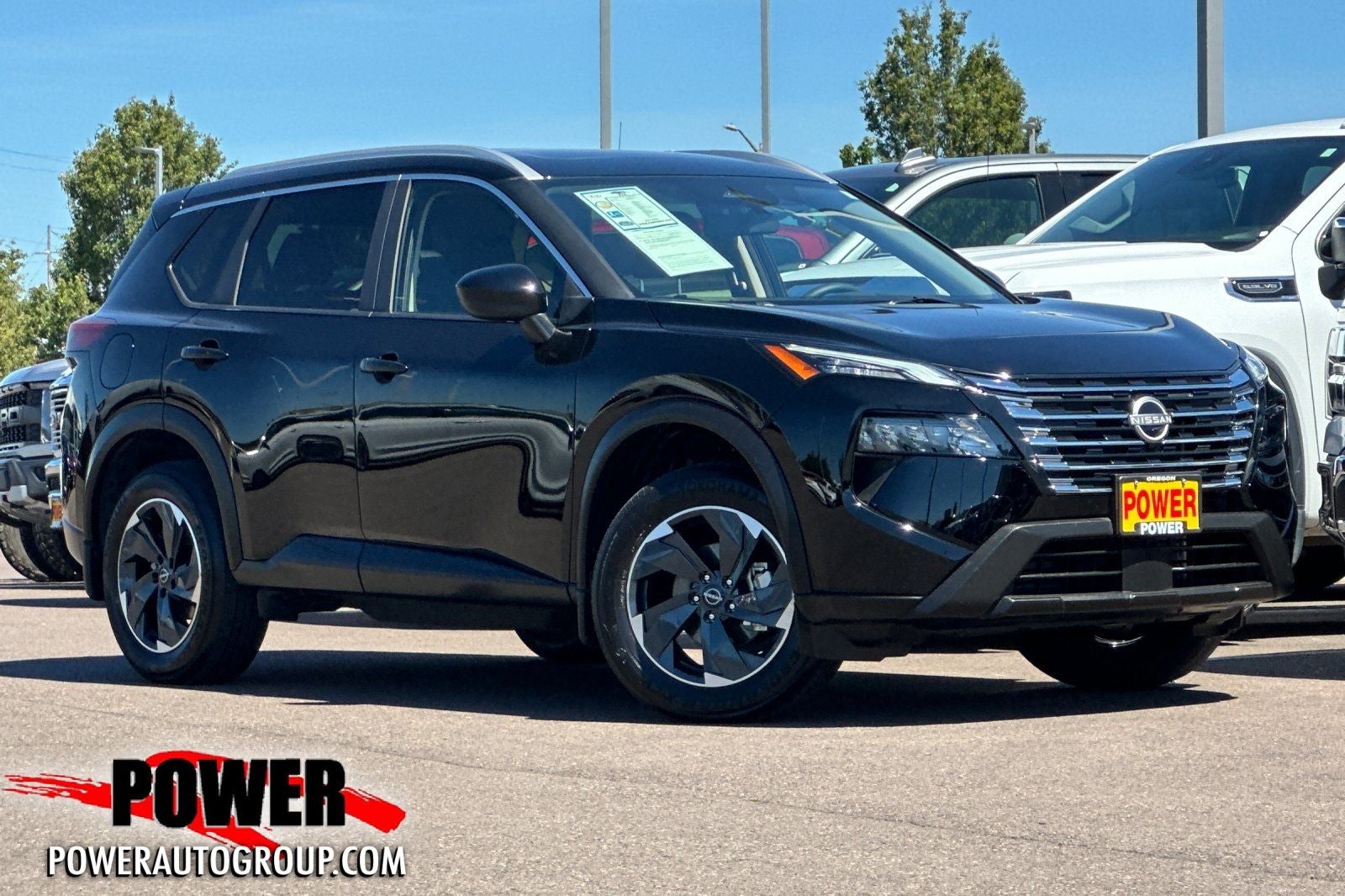 2024 Nissan Rogue SV in Super Black — front three-quarter view