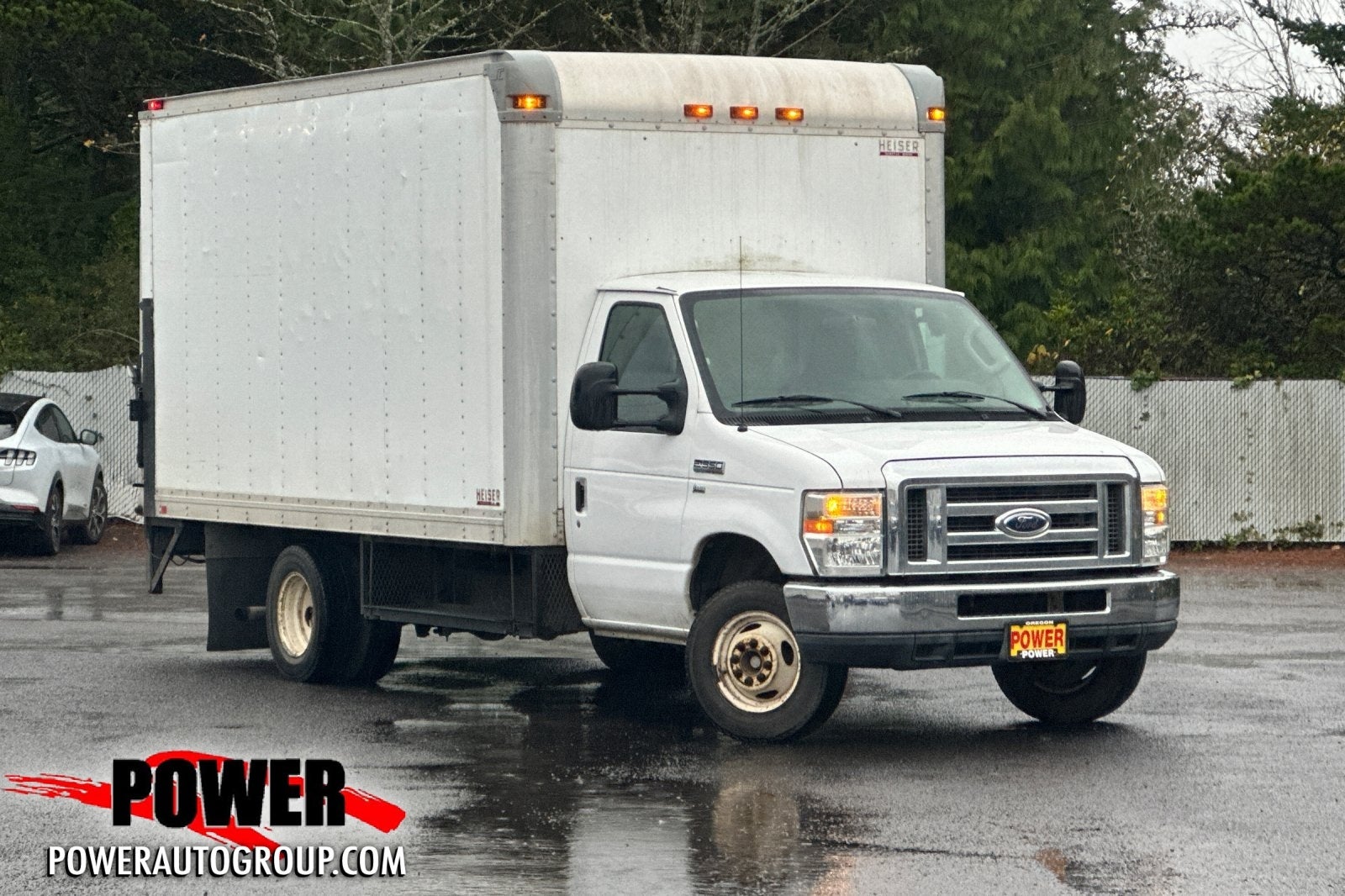 2011 Ford E-350SD 14 FT Power Lift Gate in Oxford White — front three-quarter view